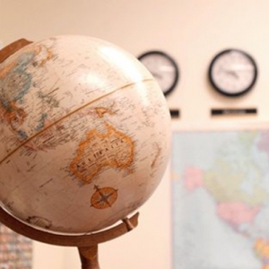 Globe and map of the world in classroom